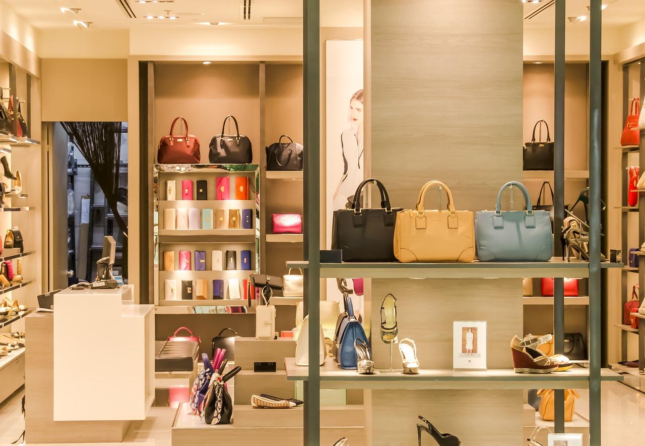 stylish retail store interior with female handbags in shelves